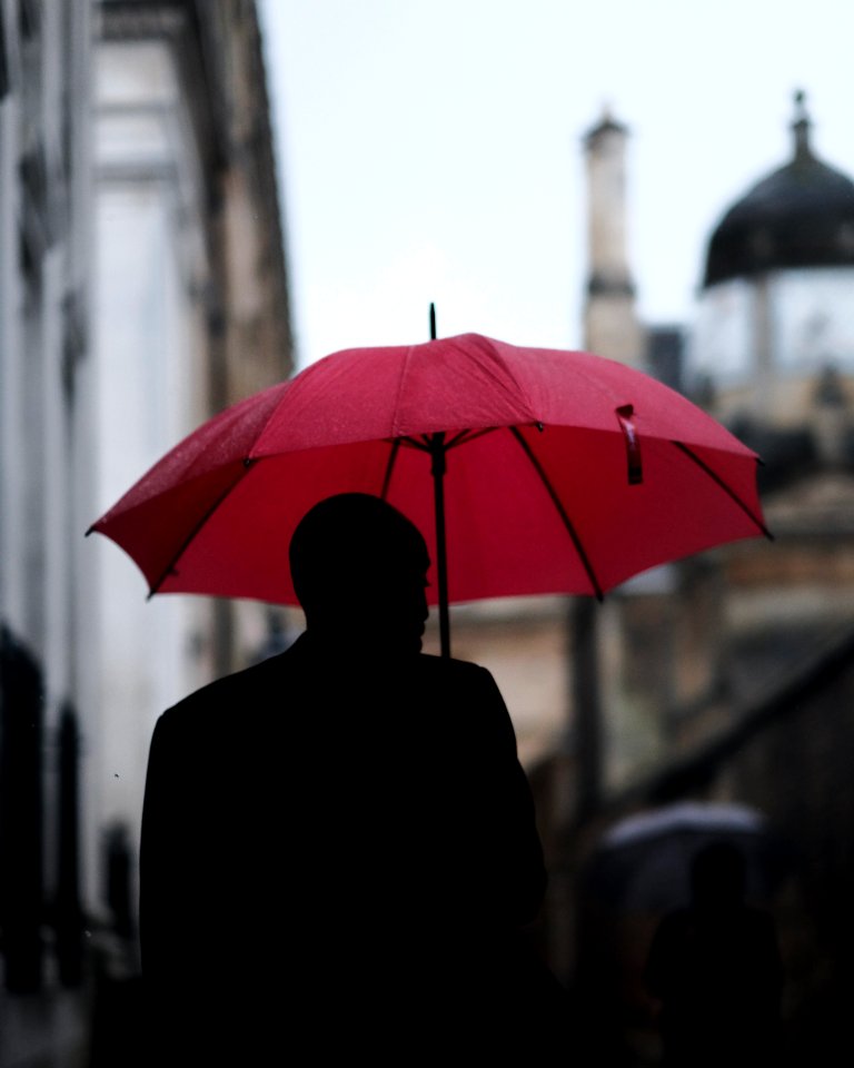 man holding umbrella