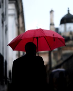 man holding umbrella photo