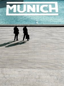 two person standing near body of water photo