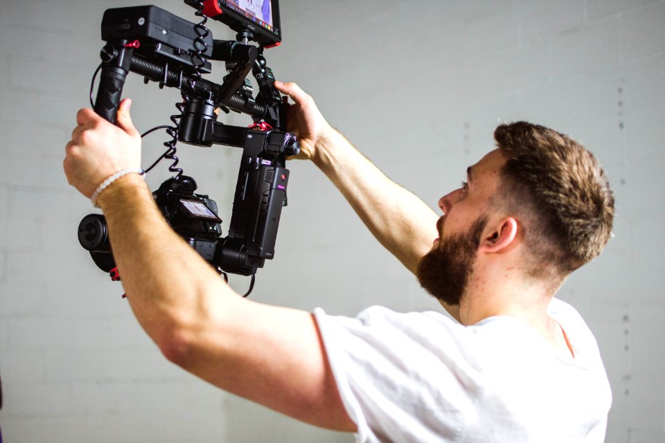 man holding camera with stabilizer