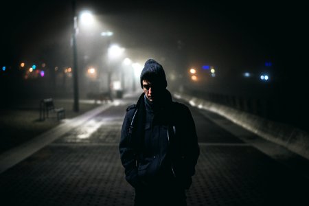 man standing near street lights photo