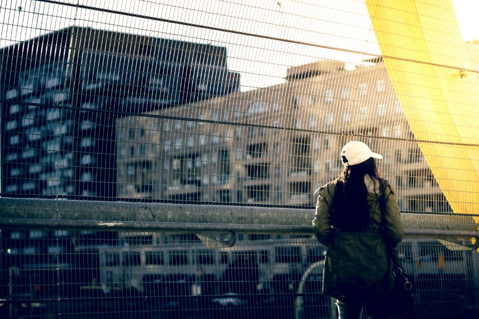woman standing and looking buildings