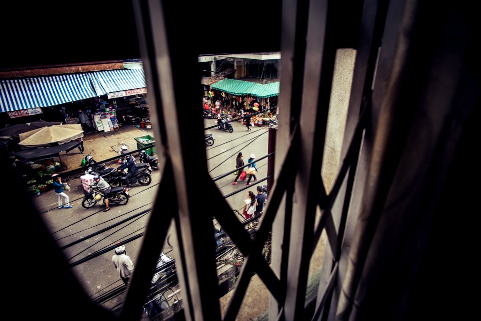 people walking on road between park motorcycles