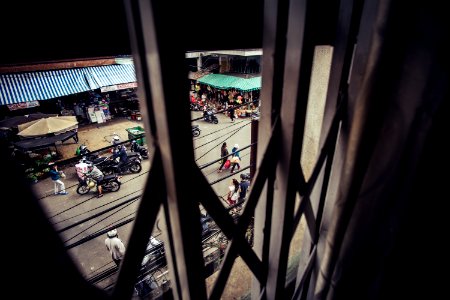 people walking on road between park motorcycles