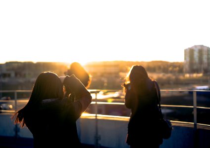 woman taking photo of another woman