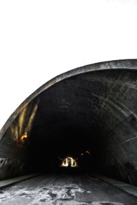 empty tunnel with lights at daytime photo