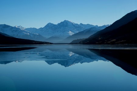 mountain near on body of water photo