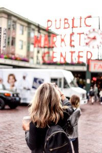 woman standing in front of Public Market Center photo