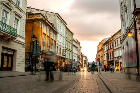 people near buildings and road photo