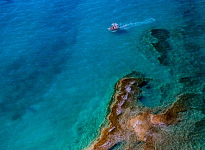 aerial photography of boat on body of water