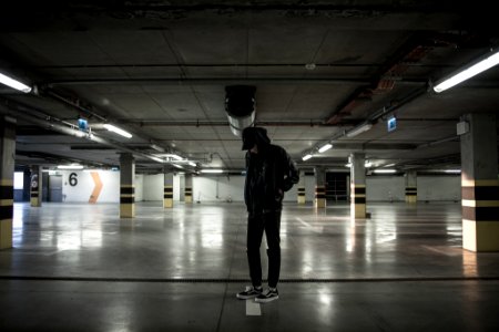 man standing in parking lot photo