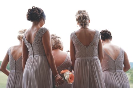bridesmaids wearing gray gowns photo
