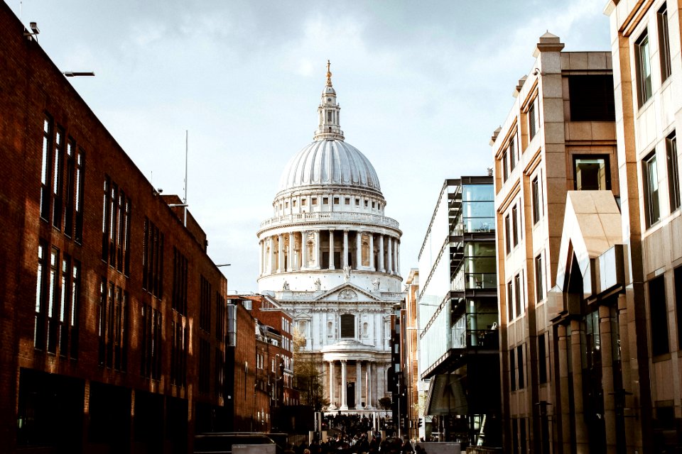 white building with dome under white clouds during daytime