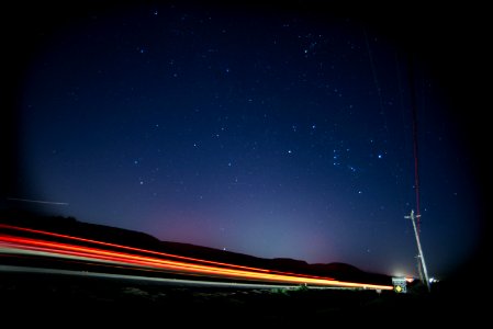 timelapse photography of vehicle lights on road during nighttime photo