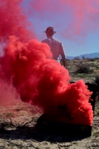 Red smoke in the desert.
