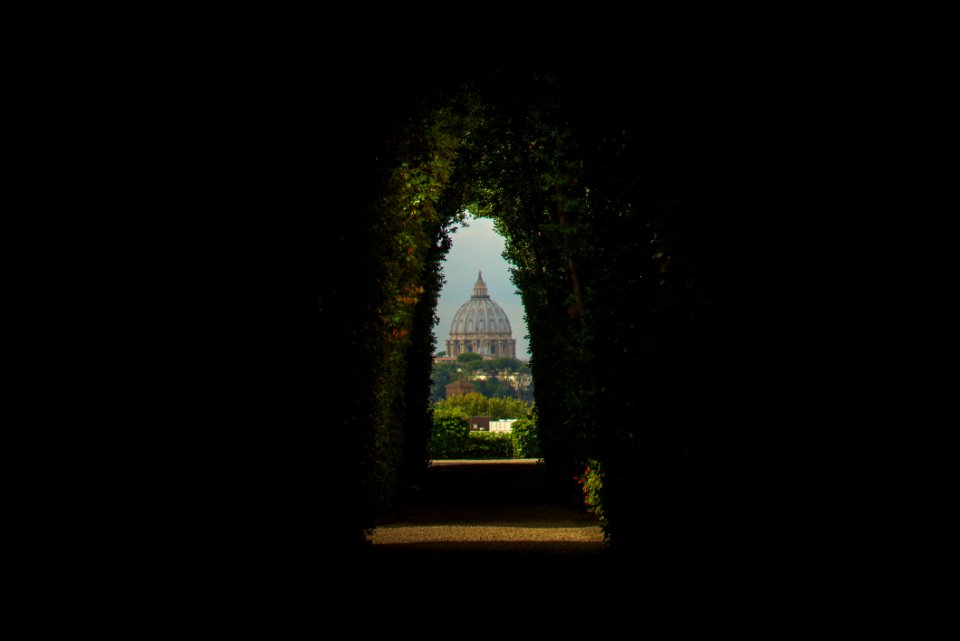 green hallway towards mosque