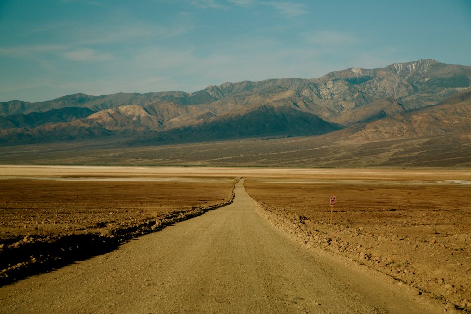 widening road leading to mountain photo