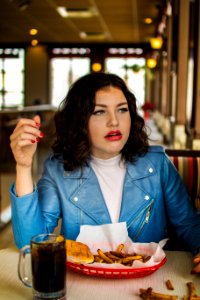 woman sitting beside table photo