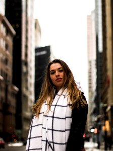 women's wearing black and white plaid scarf photo