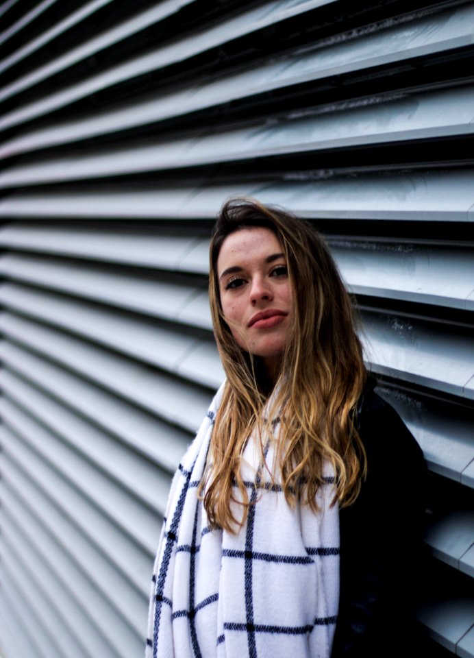 woman leaning on wall