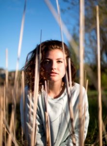 shallow focus photo of woman in gray crew-neck long-sleeved shirt photo