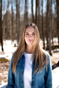 photo of a women wearing washed denim jacket photo