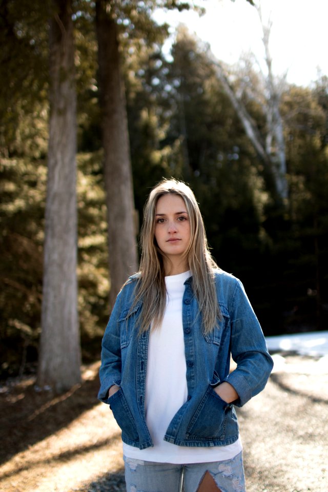 woman in blue denim button-up jacket
