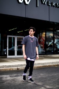 man standing beside stone photo