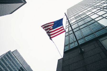 flag of America waving under gray skies photo