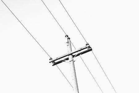 low-angle photography of grey electric post photo