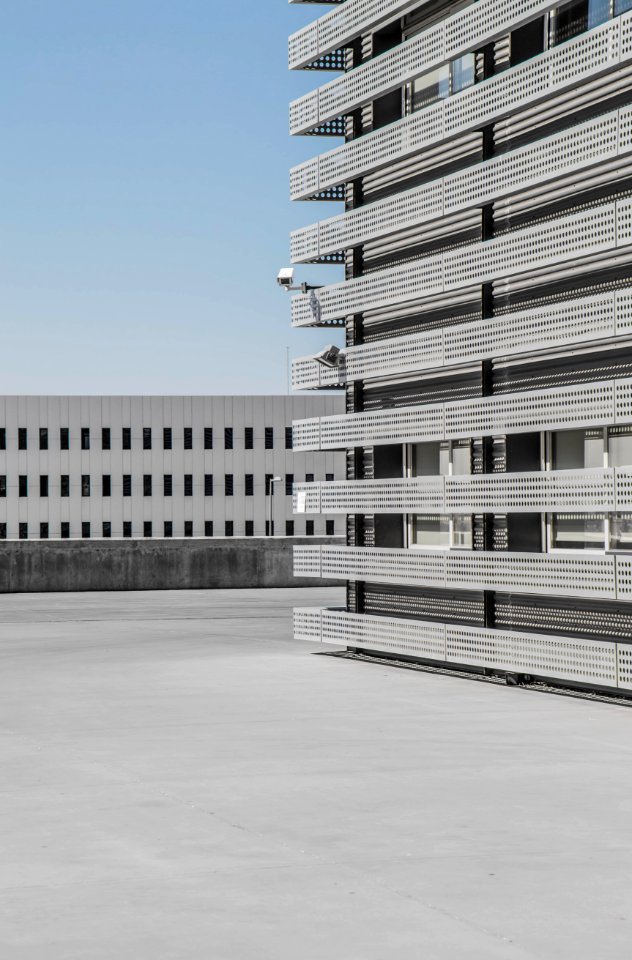 white and gray high-rise building under blue sky at daytime photo