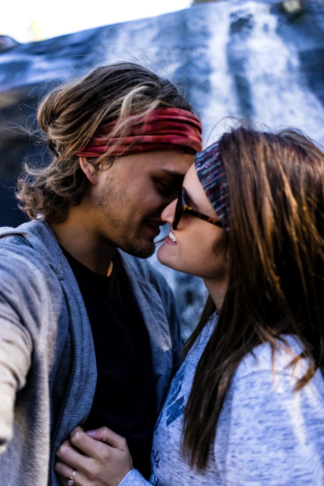 man and woman about to kiss each other photo