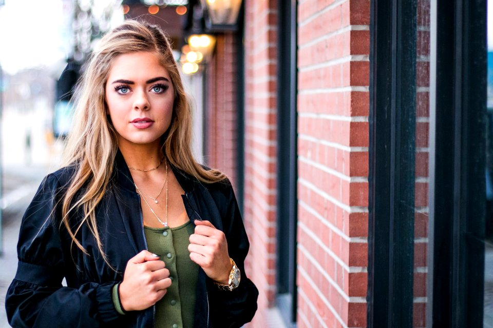 woman standing beside wall