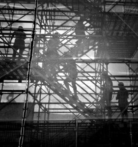 black and white photo of people going upstairs photo
