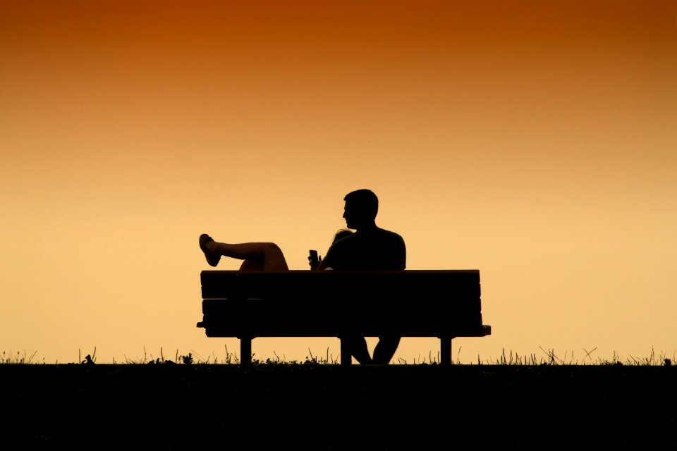 silhouette of couple on the bench painting