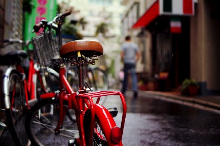 selective focus photography of red bicycle photo