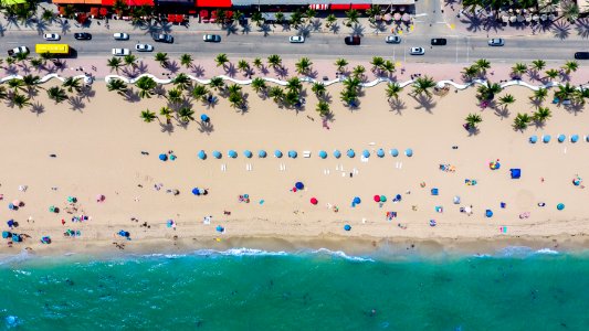aerial photography of coastline with people photo