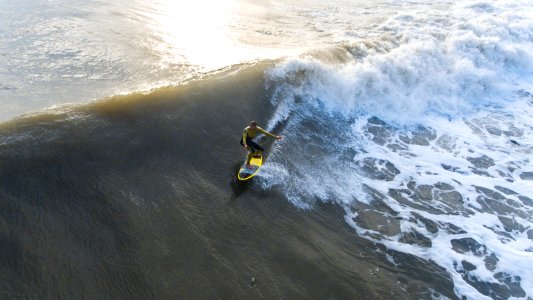 man surfing on waves photo