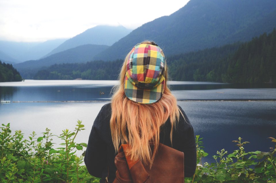 woman staring body of water