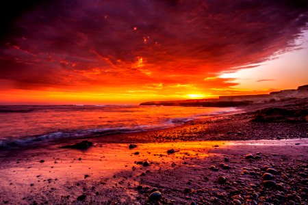 body of water under red sky photo photo