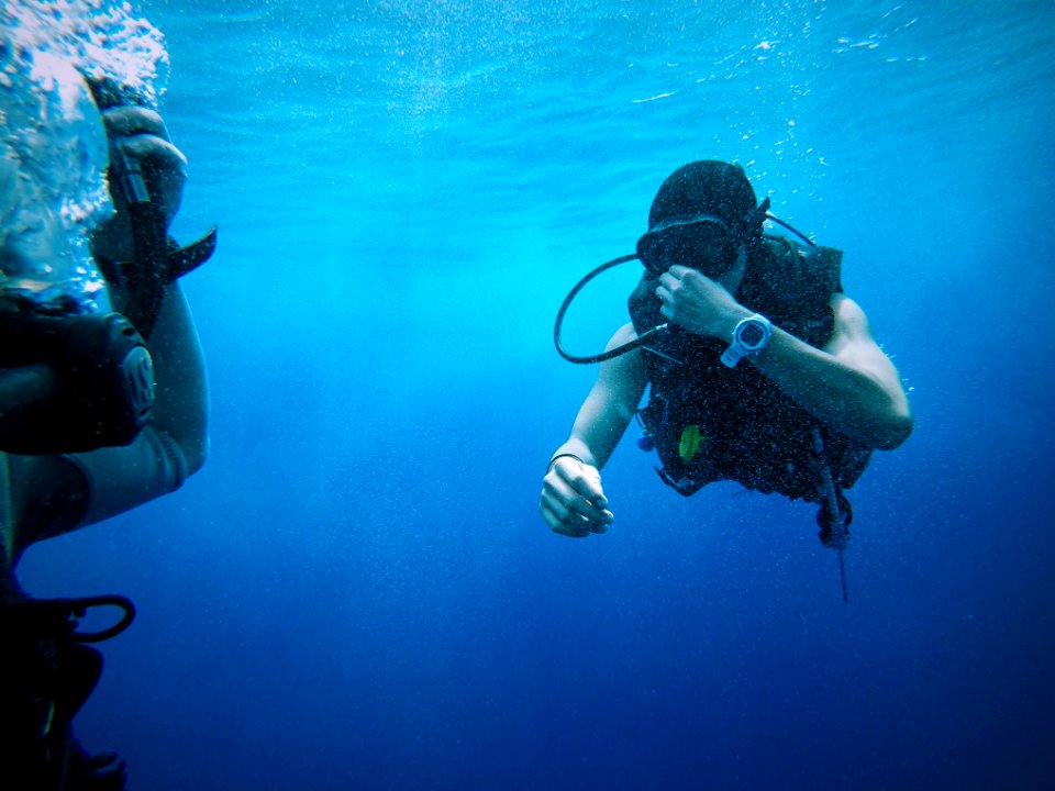 person scuba underwater