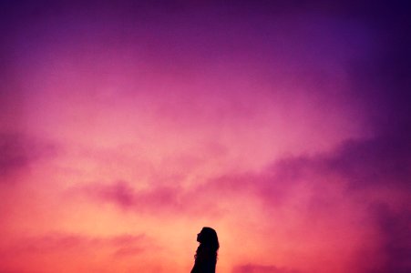 silhouette of woman during sunset photo