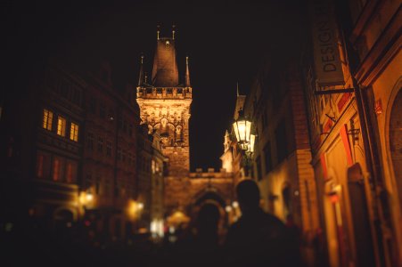 people standing near brown concrete tower photo