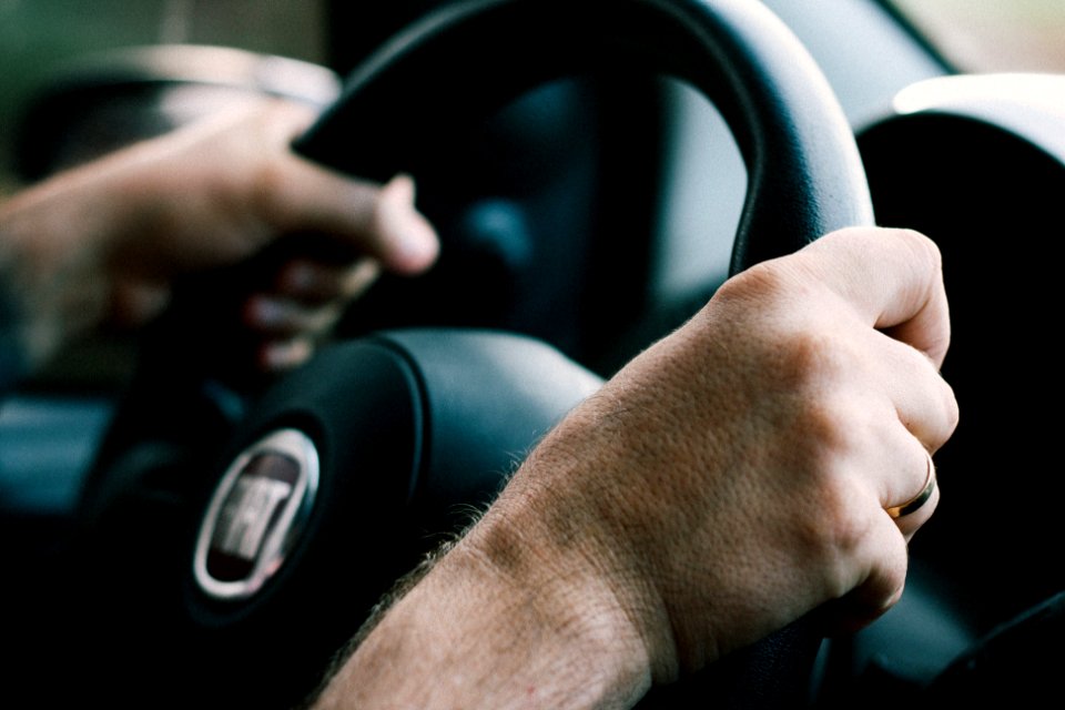man driving Fiat car