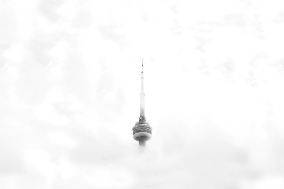 CNN Tower in Canada surrounded by clouds