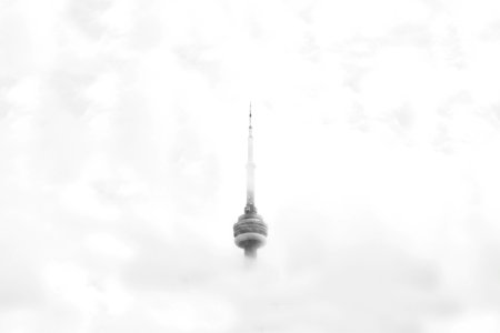 CNN Tower in Canada surrounded by clouds photo
