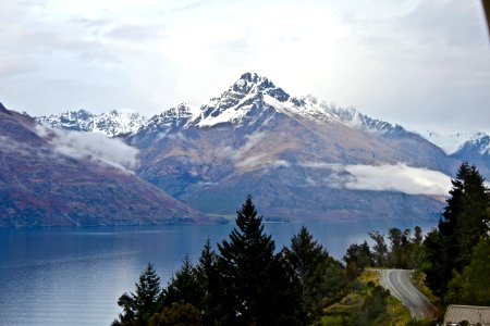 body of water near mountain at daytime photo