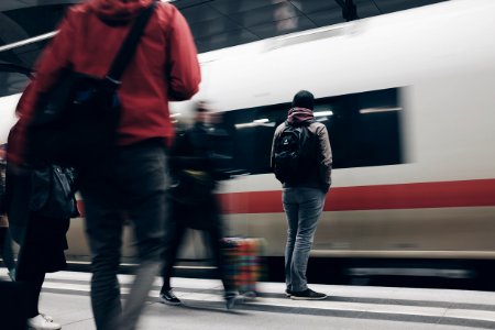 people standing beside train photo