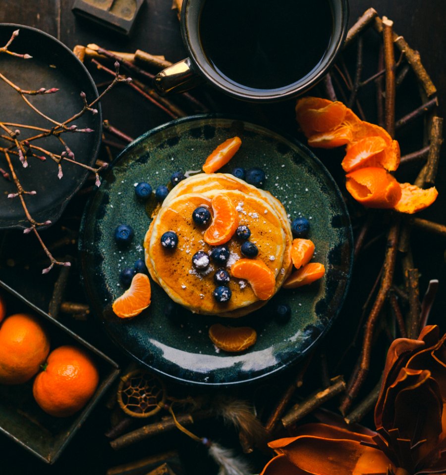 pancakes with orange and blueberry on plate