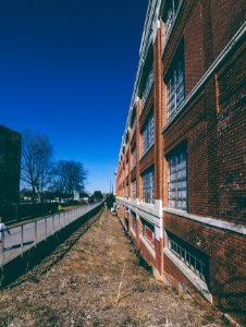 brown brick building under blue sky during daytime photo